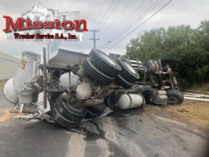 Concrete Mixer prior to heavy equipment towing-by mission wrecker team